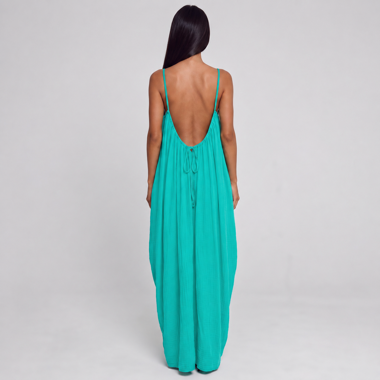 A single green leaf against a white background.